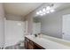 Well-lit bathroom with a long vanity, a shower-tub combo, and modern fixtures at 2030 Beyers Landing Dr, Buford, GA 30519