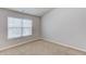Bright bedroom with a window, neutral walls, and carpet flooring to offer comfort and style at 2030 Beyers Landing Dr, Buford, GA 30519