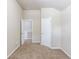 Cozy bedroom featuring neutral walls, carpet flooring, and two doors for easy access at 2030 Beyers Landing Dr, Buford, GA 30519
