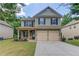 Charming two-story home with a two-car garage and traditional curb appeal at 2030 Beyers Landing Dr, Buford, GA 30519