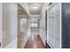 Bright foyer showcasing hardwood floors, wainscoting, and an open floor plan at 2030 Beyers Landing Dr, Buford, GA 30519