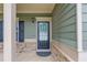 Close-up of the front door featuring traditional design and neutral tones at 2030 Beyers Landing Dr, Buford, GA 30519