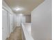 Upstairs hallway featuring carpet, white doors, baseboards and light gray walls at 2030 Beyers Landing Dr, Buford, GA 30519