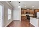 Modern kitchen with stainless steel appliances, double door to backyard, and black countertops at 2030 Beyers Landing Dr, Buford, GA 30519