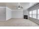 Open living room with neutral carpet, a fireplace, and bright natural light at 2030 Beyers Landing Dr, Buford, GA 30519