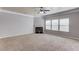 Large living room with a fireplace, ceiling fan, and lots of natural light at 2030 Beyers Landing Dr, Buford, GA 30519