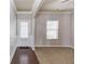 Cozy living room with neutral carpet and a door with access to the backyard at 2030 Beyers Landing Dr, Buford, GA 30519