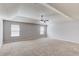 Spacious main bedroom with neutral carpet, ceiling fan, and natural light from windows at 2030 Beyers Landing Dr, Buford, GA 30519
