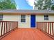 Exterior of home with a red deck, light siding and blue door at 294 Spring Leaf Dr, Dallas, GA 30157