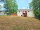 View of the backyard with house, deck, and fence at 294 Spring Leaf Dr, Dallas, GA 30157