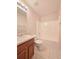 Bathroom featuring laminate floors, a sink with vanity, toilet, and bathtub at 294 Spring Leaf Dr, Dallas, GA 30157