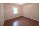 Bedroom featuring laminate flooring, a window and neutral paint at 294 Spring Leaf Dr, Dallas, GA 30157