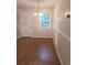 Cozy dining area featuring a chandelier, chair rail, and a large window at 294 Spring Leaf Dr, Dallas, GA 30157