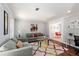 Cozy living room featuring neutral paint, hardwood floors, natural light, and comfortable seating at 440 Barrington W Dr, Roswell, GA 30076