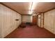 Finished basement with carpeting, paneled walls, and space for an office at 879 Old Tucker Rd, Stone Mountain, GA 30087