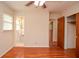 Bedroom featuring wood floors and an ensuite bathroom with vanity sink at 879 Old Tucker Rd, Stone Mountain, GA 30087