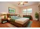 Staged bedroom featuring a modern bed with decor, nightstands, and a rug for a cozy feel at 879 Old Tucker Rd, Stone Mountain, GA 30087