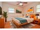 Nicely staged bedroom with neutral walls, a ceiling fan, and ample natural light at 879 Old Tucker Rd, Stone Mountain, GA 30087