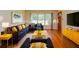 Bright living room with modern furnishings, hardwood floors and blue sectional sofa at 879 Old Tucker Rd, Stone Mountain, GA 30087