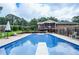 Large backyard swimming pool featuring a diving board and outdoor seating and deck at 879 Old Tucker Rd, Stone Mountain, GA 30087