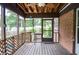 A screened in back porch with a view of the back yard at 879 Old Tucker Rd, Stone Mountain, GA 30087
