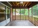 A screened in back porch with a view of the back yard at 879 Old Tucker Rd, Stone Mountain, GA 30087