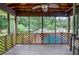Relaxing screened-in porch overlooking the pool and backyard, perfect for outdoor enjoyment at 879 Old Tucker Rd, Stone Mountain, GA 30087