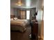 A cozy bedroom with a comfortable bed, neutral decor, and a window providing natural light, creating a serene space at 989 Park Knoll Ct, Lawrenceville, GA 30043