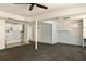 Basement with gray carpet flooring and white cabinets at 1392 Cornwall Rd, Decatur, GA 30032