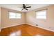 Bedroom with hardwood floors, ceiling fan, and windows that let in natural light at 1392 Cornwall Rd, Decatur, GA 30032