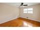 Bedroom with hardwood floors, ceiling fan, and windows that let in natural light at 1392 Cornwall Rd, Decatur, GA 30032