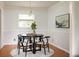 Charming dining area featuring a modern chandelier, and a picturesque window with natural light at 1392 Cornwall Rd, Decatur, GA 30032