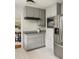 Well-lit kitchen features gray cabinets, granite countertops, subway tile backsplash, and stainless steel appliances at 1392 Cornwall Rd, Decatur, GA 30032