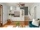 Spacious living room with hardwood floors, custom built-ins, and a view to the stairs to the upper level at 1392 Cornwall Rd, Decatur, GA 30032
