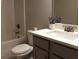 Bathroom featuring a white toilet, shower and modern vanity at 1783 Shetley Creek Drive, Norcross, GA 30071