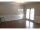 This dining room features hardwood floors, decorative molding, and double doors at 1783 Shetley Creek Drive, Norcross, GA 30071
