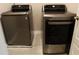 Modern silver washer and dryer in the laundry room at 1783 Shetley Creek Drive, Norcross, GA 30071