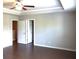 This main bedroom has hard wood flooring, a ceiling fan, and neutral paint at 1783 Shetley Creek Drive, Norcross, GA 30071