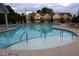 Community pool with a zero entry point, surrounded by lounge chairs and umbrellas at 1783 Shetley Creek Drive, Norcross, GA 30071