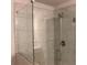 Frameless shower with clear glass doors and tile surround at 1783 Shetley Creek Drive, Norcross, GA 30071