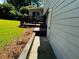 Backyard with grassy area and adjacent deck at 208 Arbour Way, Suwanee, GA 30024
