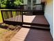 Well-maintained wooden deck with stairs, ideal for outdoor entertaining and relaxation at 208 Arbour Way, Suwanee, GA 30024