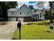 Charming two-story home featuring a well-manicured lawn, dual garage, and stone accents at 208 Arbour Way, Suwanee, GA 30024