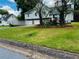 Charming home featuring a two-car garage, stone accents, and a well-maintained front yard at 208 Arbour Way, Suwanee, GA 30024