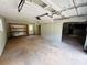 Spacious garage featuring a side entrance, offering additional space and accessibility at 208 Arbour Way, Suwanee, GA 30024