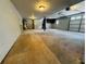 Spacious garage with overhead lighting and painted walls at 208 Arbour Way, Suwanee, GA 30024