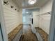 Hallway featuring granite countertops, a rack, and built-in cabinetry at 208 Arbour Way, Suwanee, GA 30024