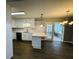 Spacious kitchen with white cabinets, modern appliances, and an island, perfect for entertaining and casual dining at 208 Arbour Way, Suwanee, GA 30024