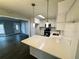 Well-appointed kitchen features stainless steel appliances, white cabinets, and sleek countertops at 208 Arbour Way, Suwanee, GA 30024