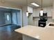 Bright kitchen showcasing modern appliances, white cabinets, and a large island at 208 Arbour Way, Suwanee, GA 30024